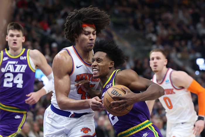 Dec 13, 2023; Salt Lake City, Utah, USA; Utah Jazz guard Collin Sexton (2) drives to the basket against New York Knicks center Jericho Sims (45) during the third quarter at Delta Center.